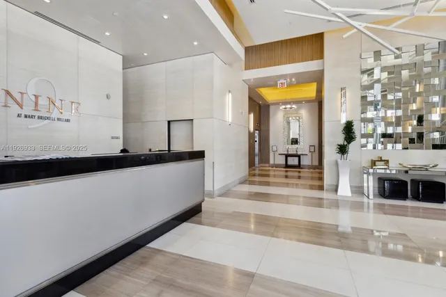 a lobby with a sink and mirror