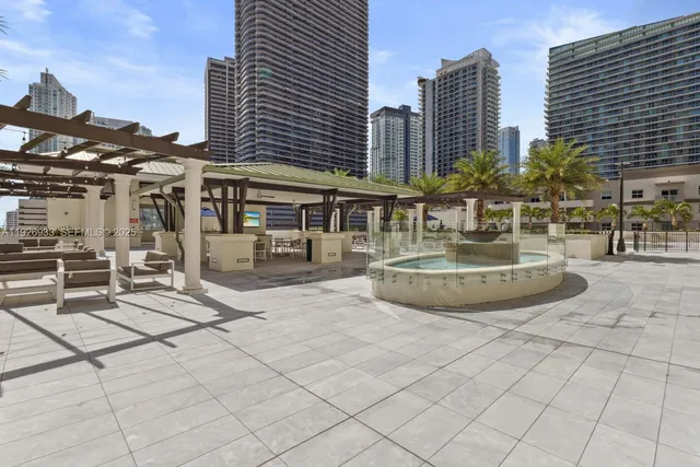 a patio with a table and chairs