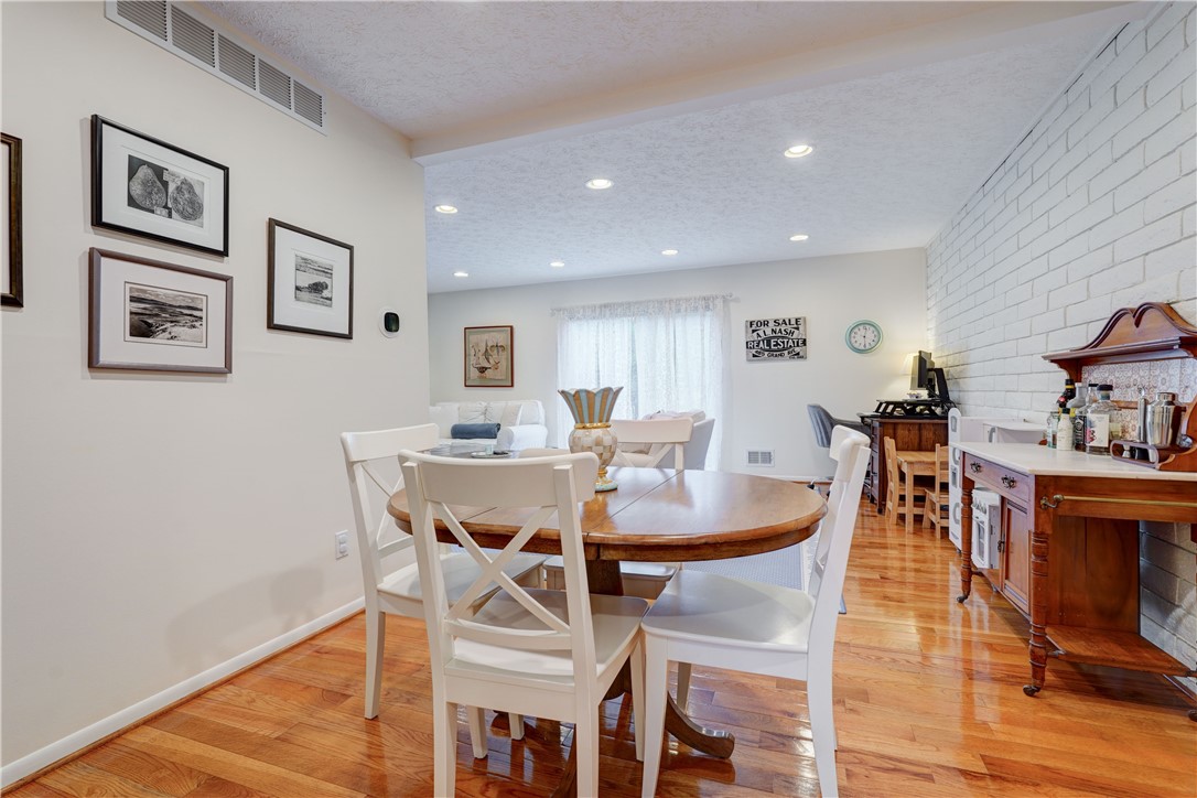 665 French Road Brighton, NY 14618 - Photo 8 of 35 The Dining room opens to the living room for easy