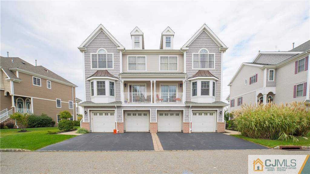 34 Raritan Reach Road, Unit 17 South Amboy, NJ 08879 - Photo 2 of 25 a front view of a building with a street