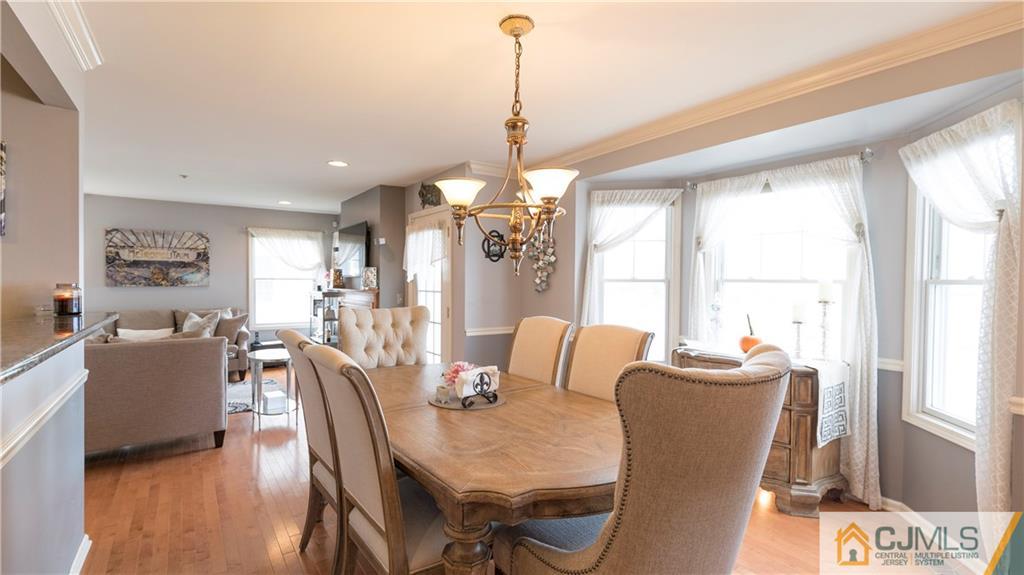 34 Raritan Reach Road, Unit 17 South Amboy, NJ 08879 - Photo 11 of 25 a dining room with furniture window wooden floor