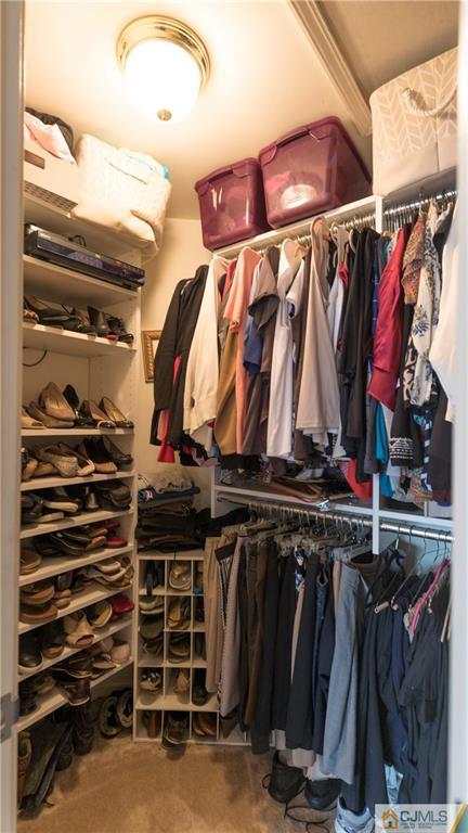 34 Raritan Reach Road, Unit 17 South Amboy, NJ 08879 - Photo 15 of 25 a view of walk in closet with clothes and shoes