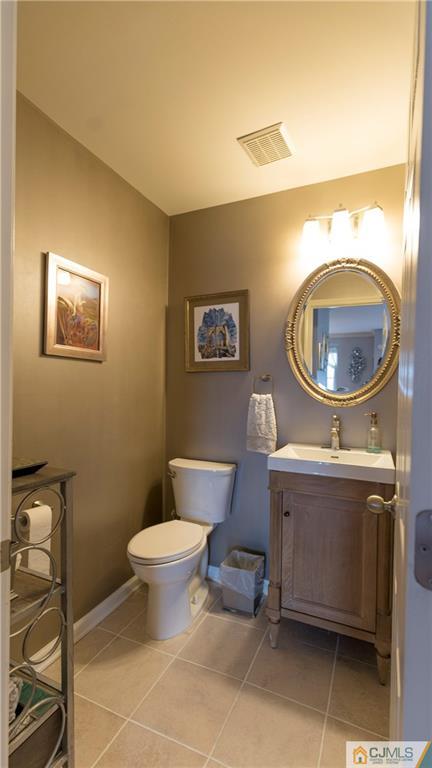 34 Raritan Reach Road, Unit 17 South Amboy, NJ 08879 - Photo 17 of 25 a bathroom with a toilet and a sink