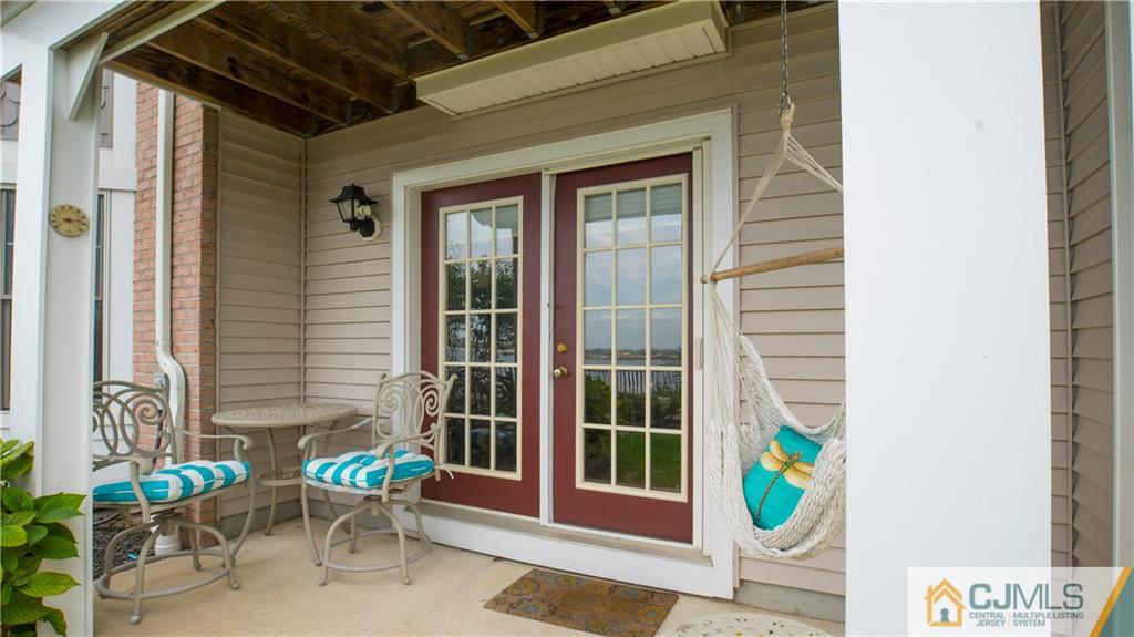 34 Raritan Reach Road, Unit 17 South Amboy, NJ 08879 - Photo 18 of 25 a front view of a house with outdoor seating