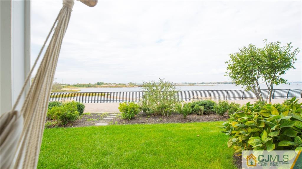 34 Raritan Reach Road, Unit 17 South Amboy, NJ 08879 - Photo 20 of 25 a view of a garden with a lake view
