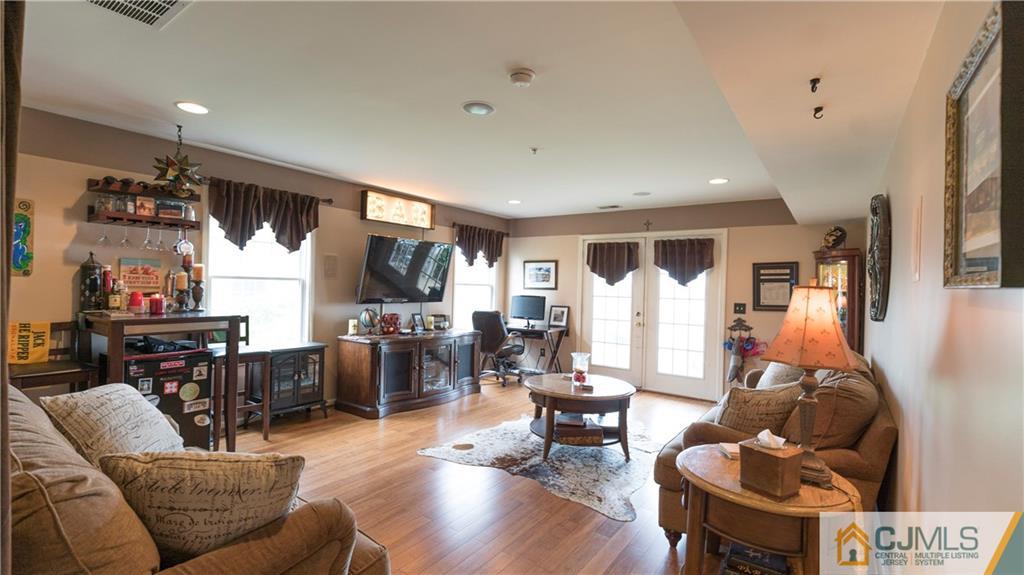 34 Raritan Reach Road, Unit 17 South Amboy, NJ 08879 - Photo 21 of 25 a living room with furniture and a large window