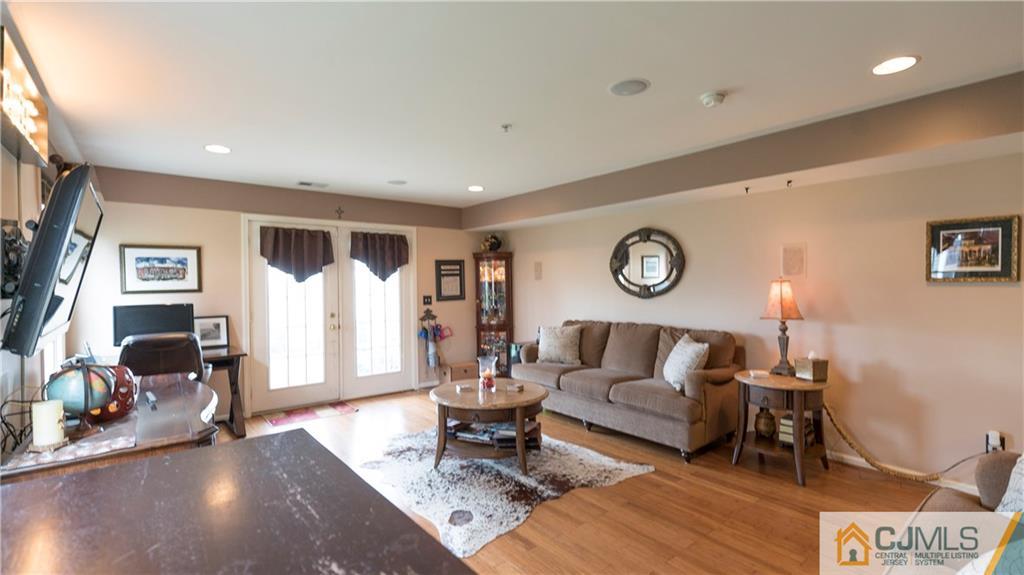 34 Raritan Reach Road, Unit 17 South Amboy, NJ 08879 - Photo 22 of 25 a living room with furniture and a large window