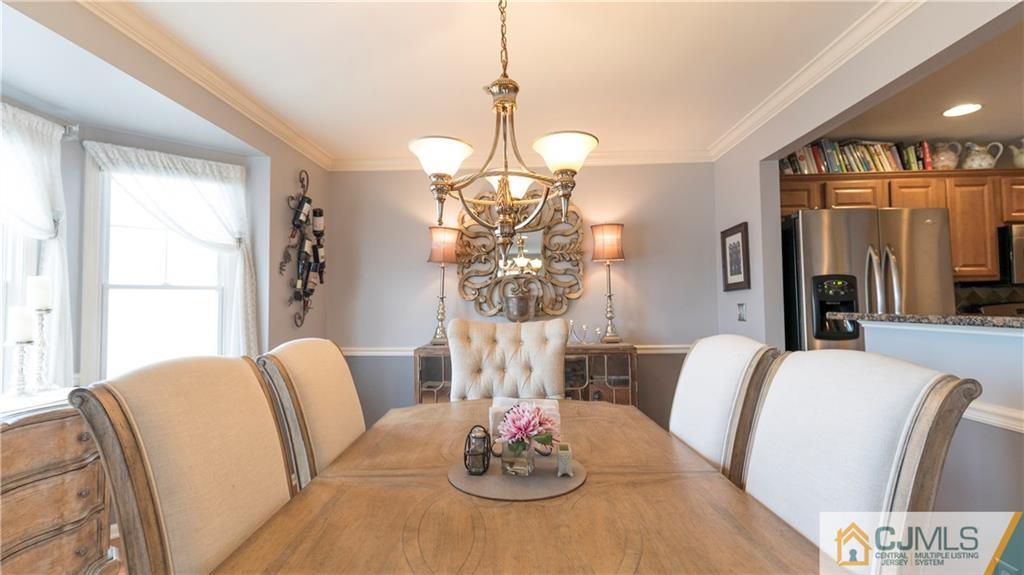34 Raritan Reach Road, Unit 17 South Amboy, NJ 08879 - Photo 9 of 25 a view of a dining room with furniture window and wooden floor