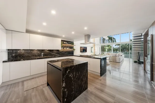 a kitchen with a stove a sink and a refrigerator