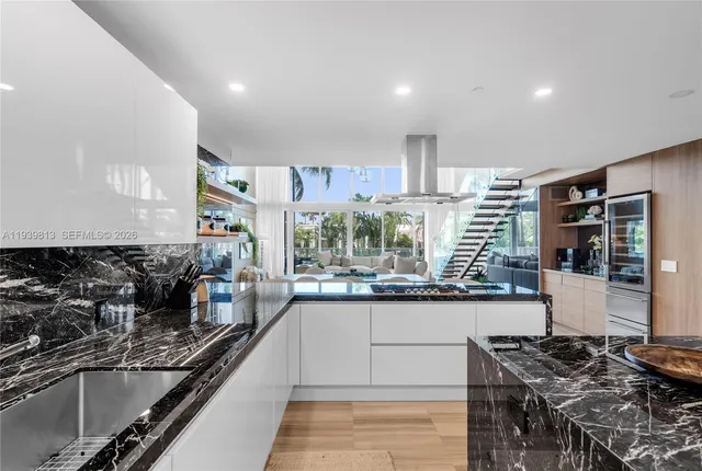 a kitchen with a sink and stove