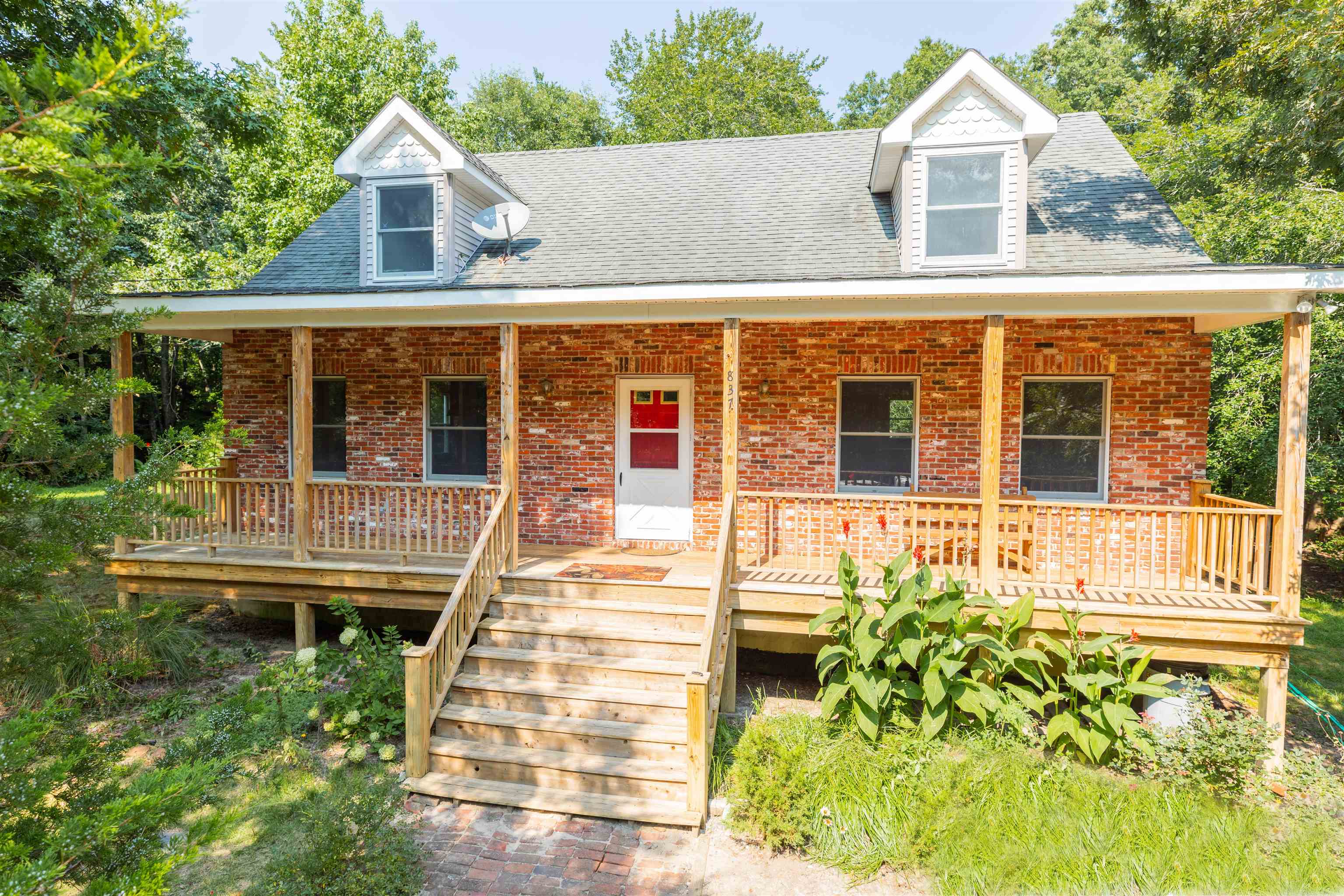 837 Weeks Landing Road Cape May, NJ 08204 - Photo 2 of 38 a front view of a house with a yard
