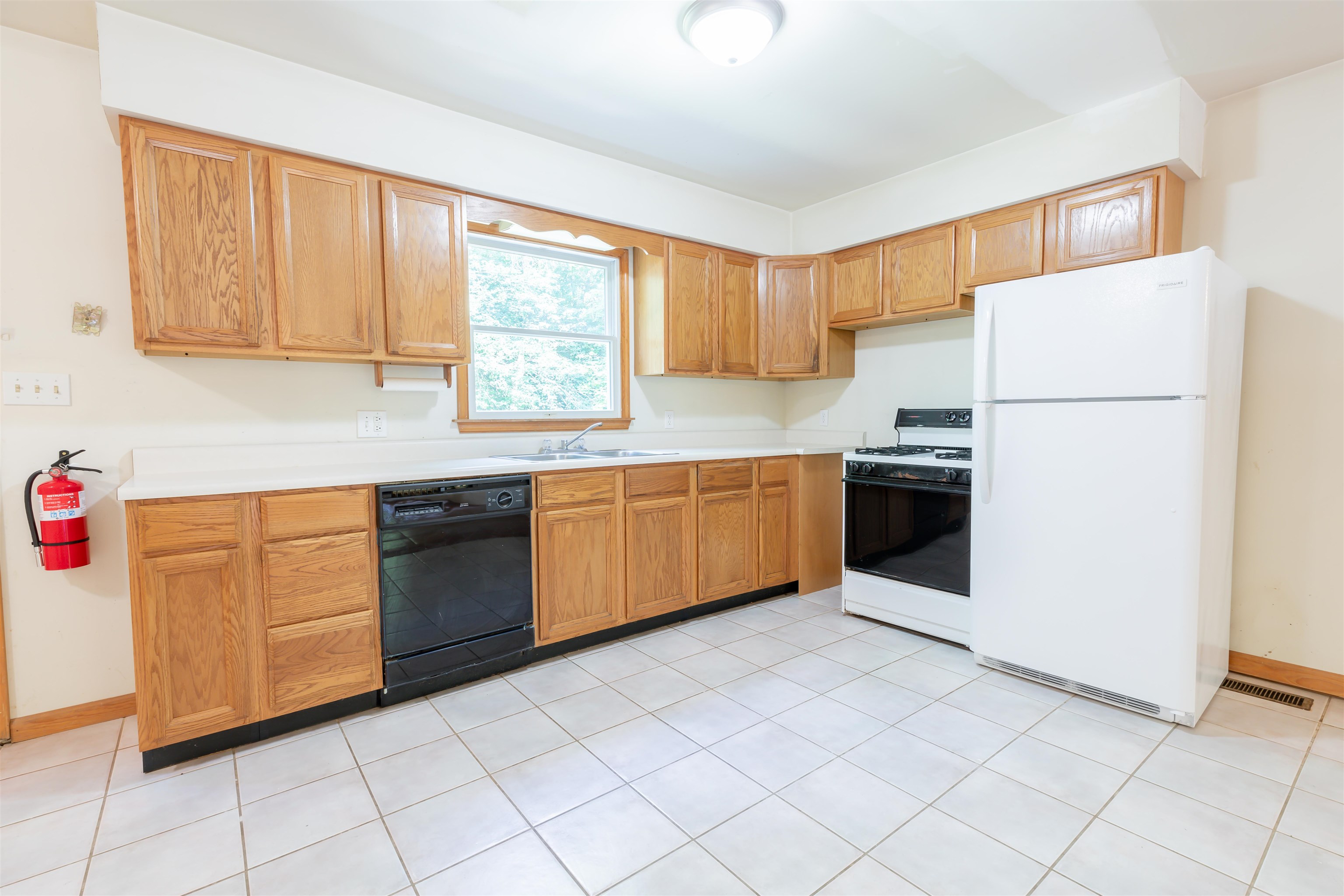 837 Weeks Landing Road Cape May, NJ 08204 - Photo 14 of 38 a kitchen with a sink a stove top oven and white cabinets