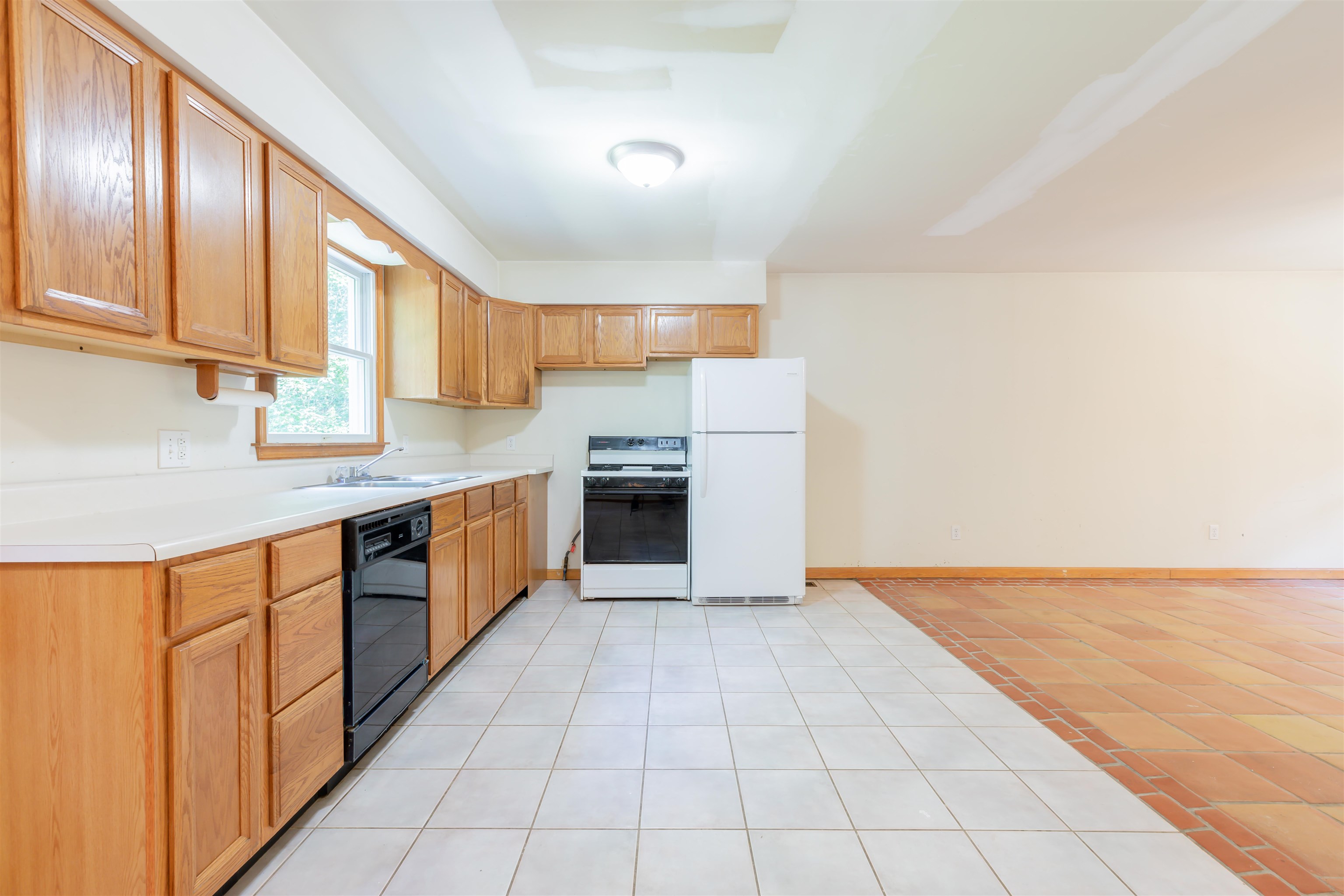 837 Weeks Landing Road Cape May, NJ 08204 - Photo 15 of 38 a large kitchen with stainless steel appliances granite countertop a stove a sink and a refrigerator