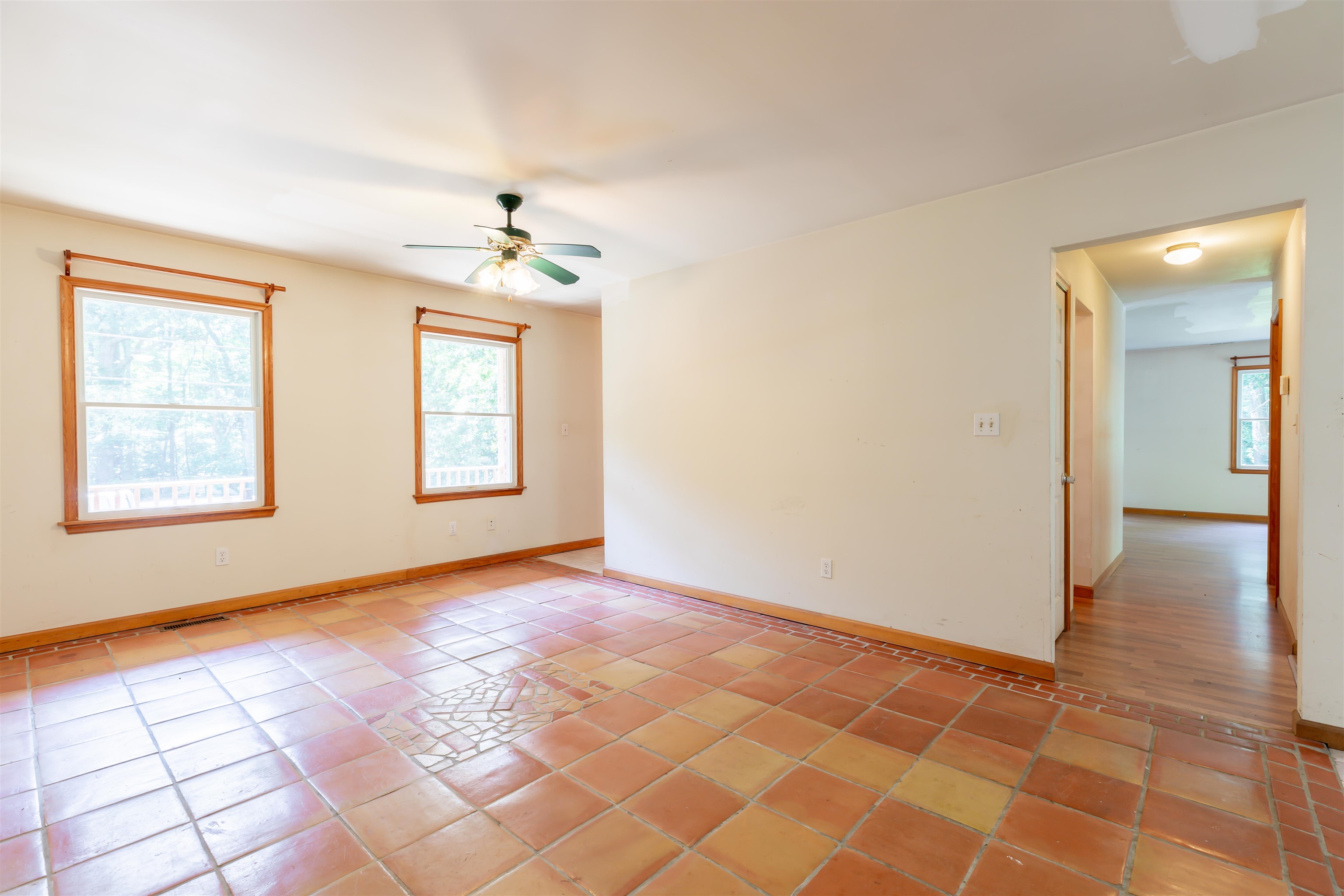 837 Weeks Landing Road Cape May, NJ 08204 - Photo 16 of 38 an empty room with windows and chandelier fan