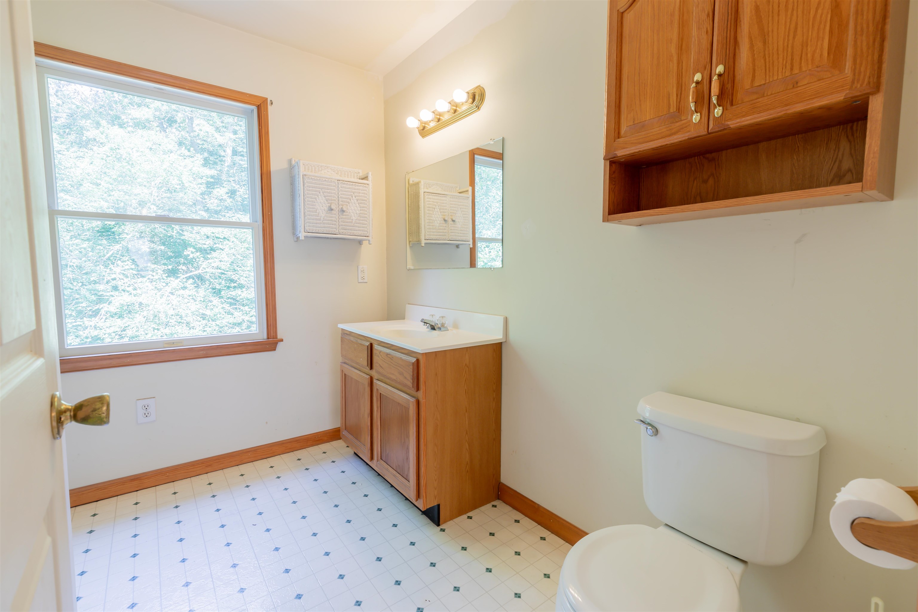 837 Weeks Landing Road Cape May, NJ 08204 - Photo 22 of 38 a bathroom with a sink toilet vanity and window