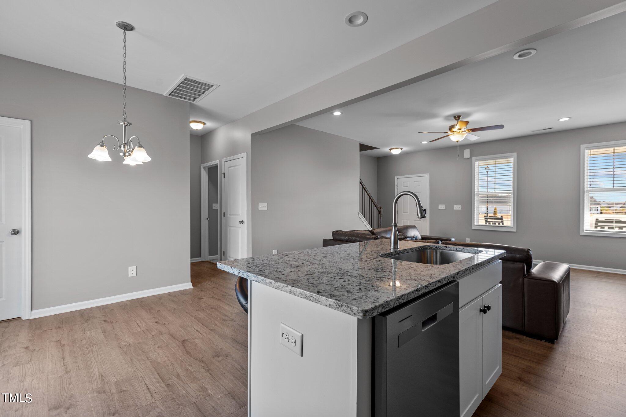 109 Longbow Drive Middlesex, NC 27557 - Photo 11 of 20 a bathroom with a granite countertop sink a toilet and a mirror