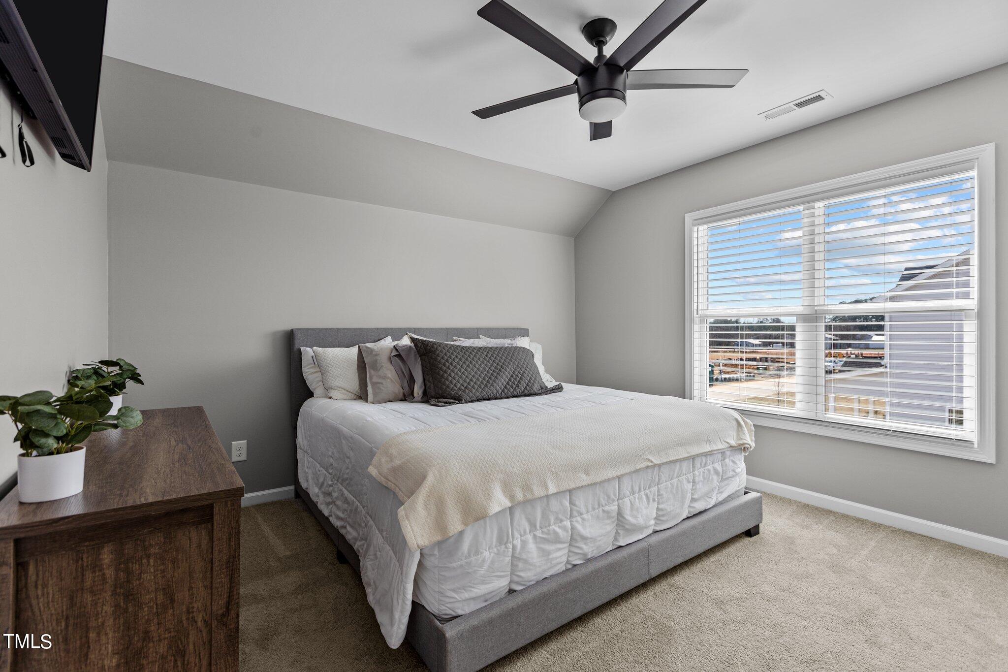 109 Longbow Drive Middlesex, NC 27557 - Photo 14 of 20 a bedroom with a bed and a window