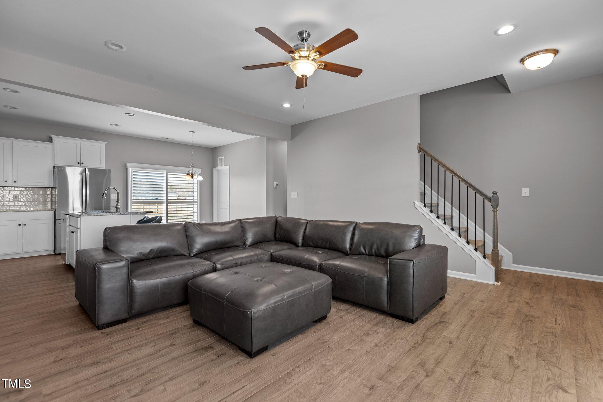 109 Longbow Drive Middlesex, NC 27557 - Photo 5 of 20 a living room with furniture and a chandelier