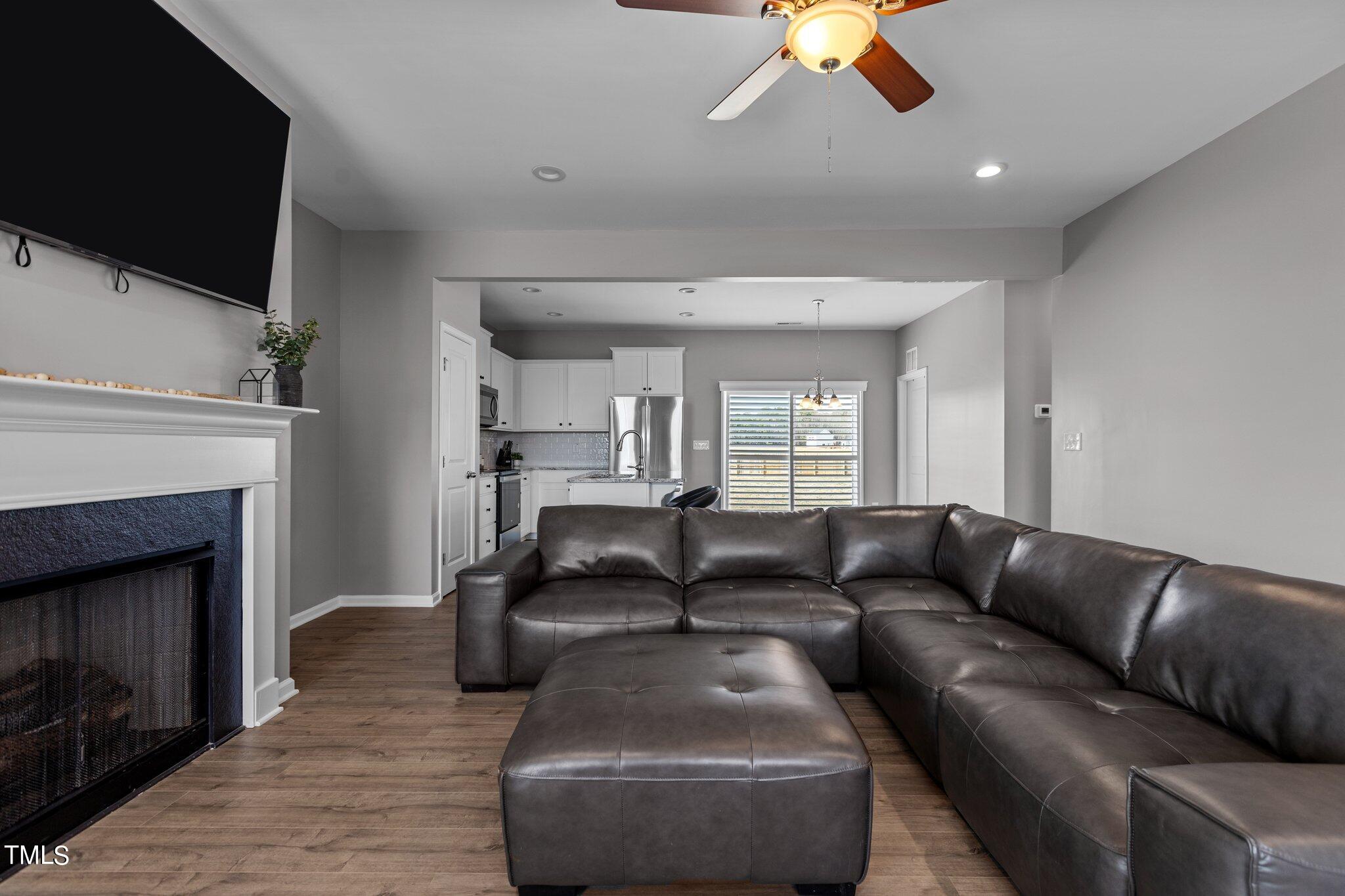109 Longbow Drive Middlesex, NC 27557 - Photo 6 of 20 a living room with furniture and a fireplace