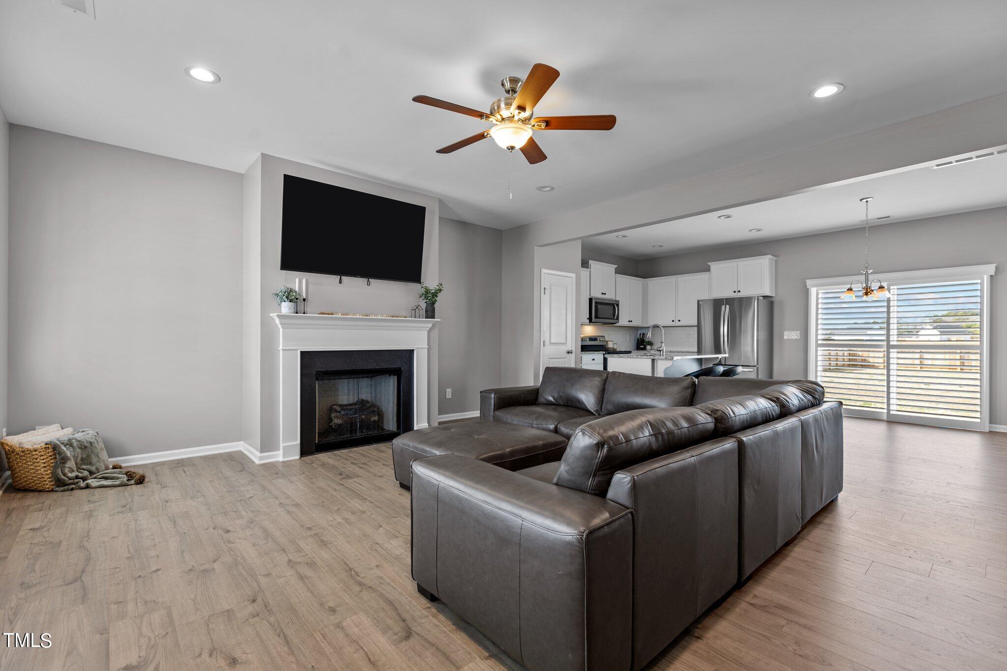 109 Longbow Drive Middlesex, NC 27557 - Photo 7 of 20 a living room with furniture fireplace and a flat screen tv