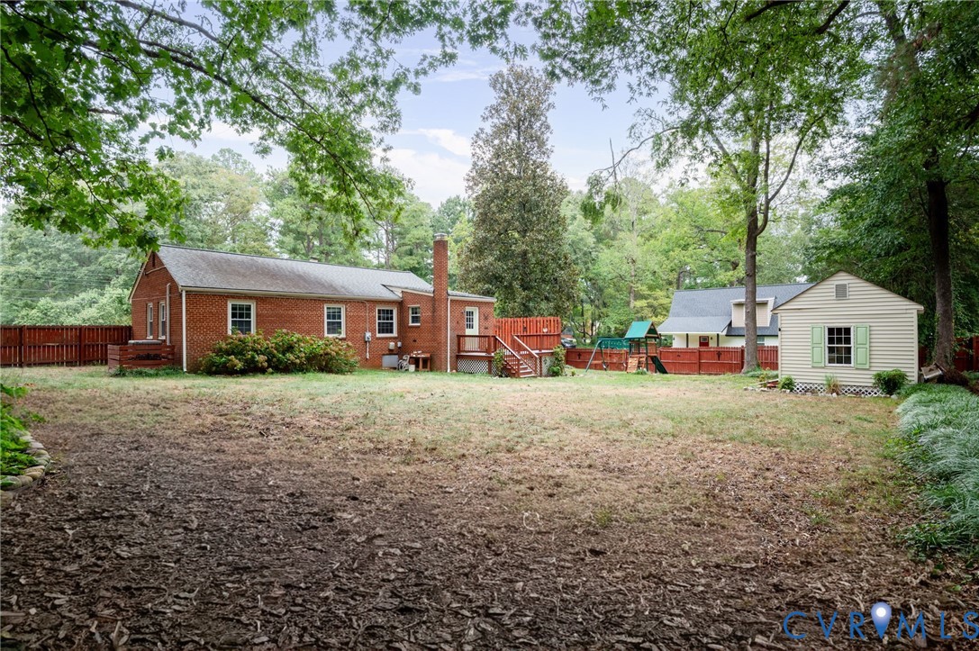 3353 Warner Road Richmond, VA 23225 - Photo 14 of 26 Brick exterior with a prominent chimney, wood deck
