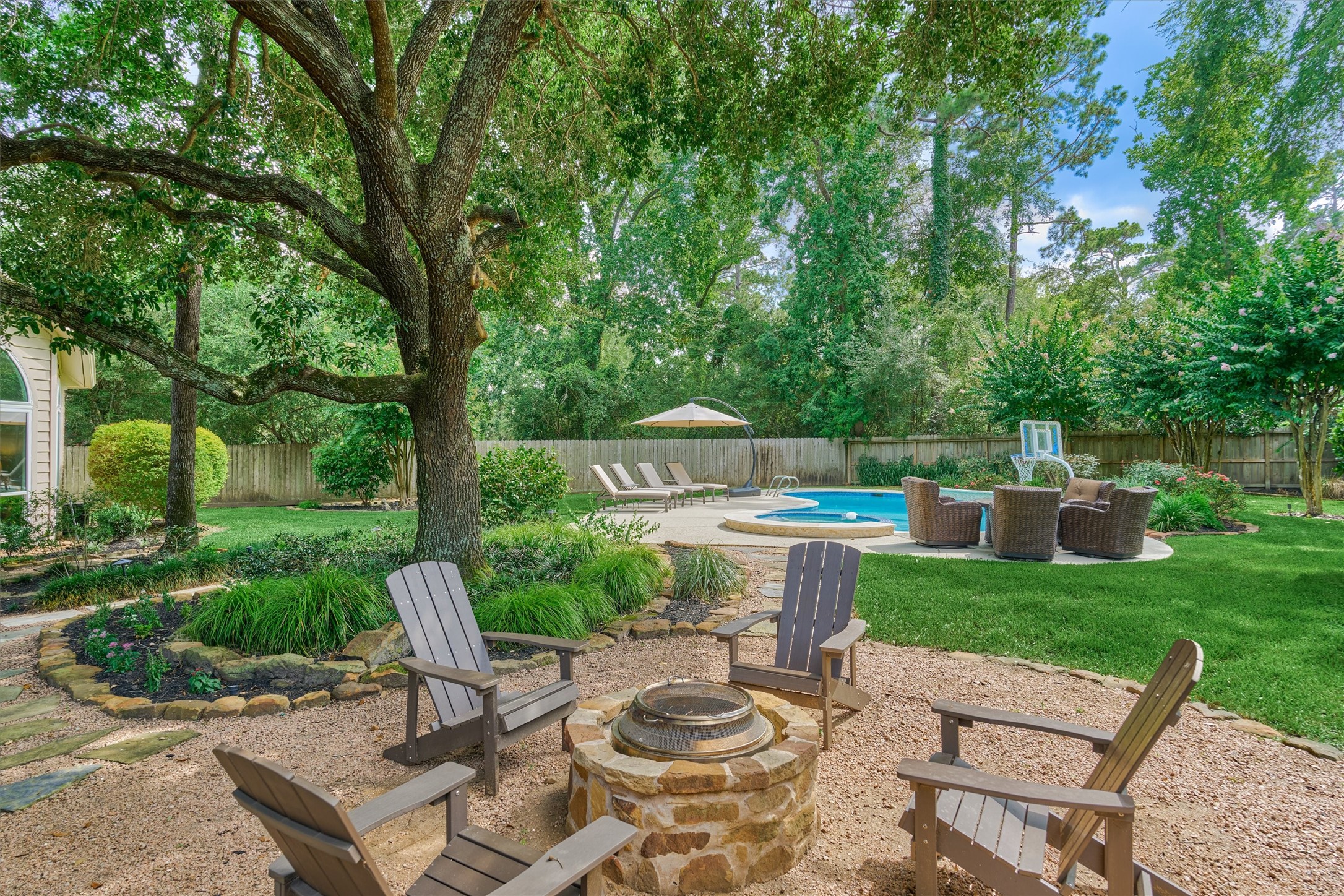 18 Treevine Court The Woodlands, TX 77381 - Photo 2 of 50 This extraordinary lot doesn't come around often! Savor year-round beauty with ultimate privacy in a setting that is unmatched with a continuous tree line and land/waterscape design that is priceless!