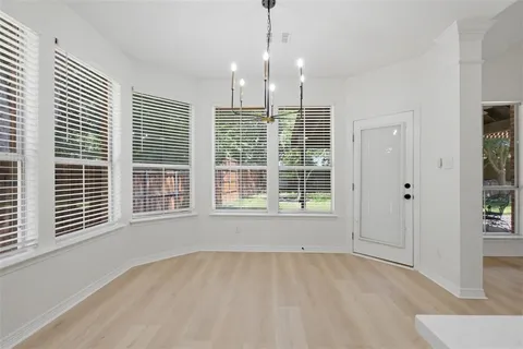 a bathroom with a toilet a sink and a mirror