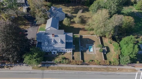 an aerial view of houses with yard