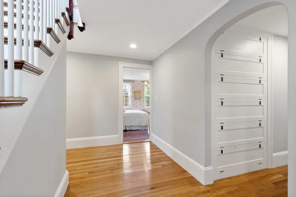 a view of an entryway with wooden floor