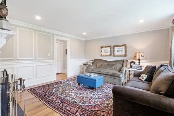 a living room with furniture and a rug