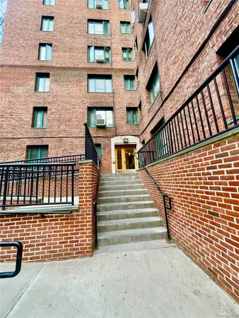 a view of a brick building with stairs