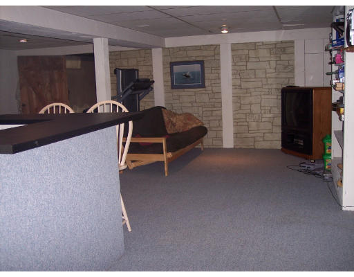 31 West Colonial Road Wilbraham, MA 01095 - Photo 3 of 10 a living room with furniture and a flat screen tv