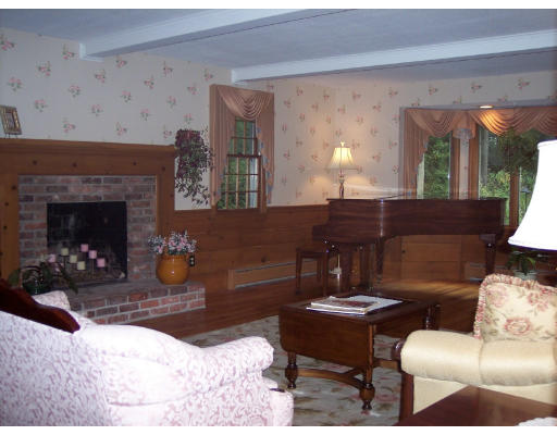 31 West Colonial Road Wilbraham, MA 01095 - Photo 8 of 10 a living room with furniture and a fireplace