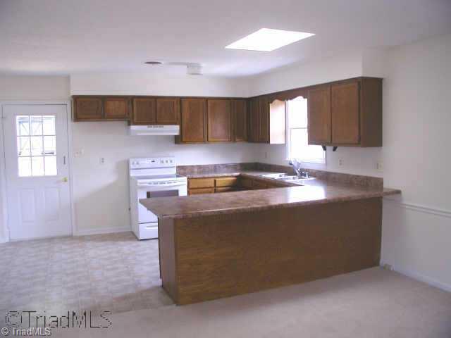 1940 Murrayhill Road Greensboro, NC 27403 - Photo 4 of 5 Other. Kitchen with new vinyl floor, counter-tops, and plumbing fixtures.