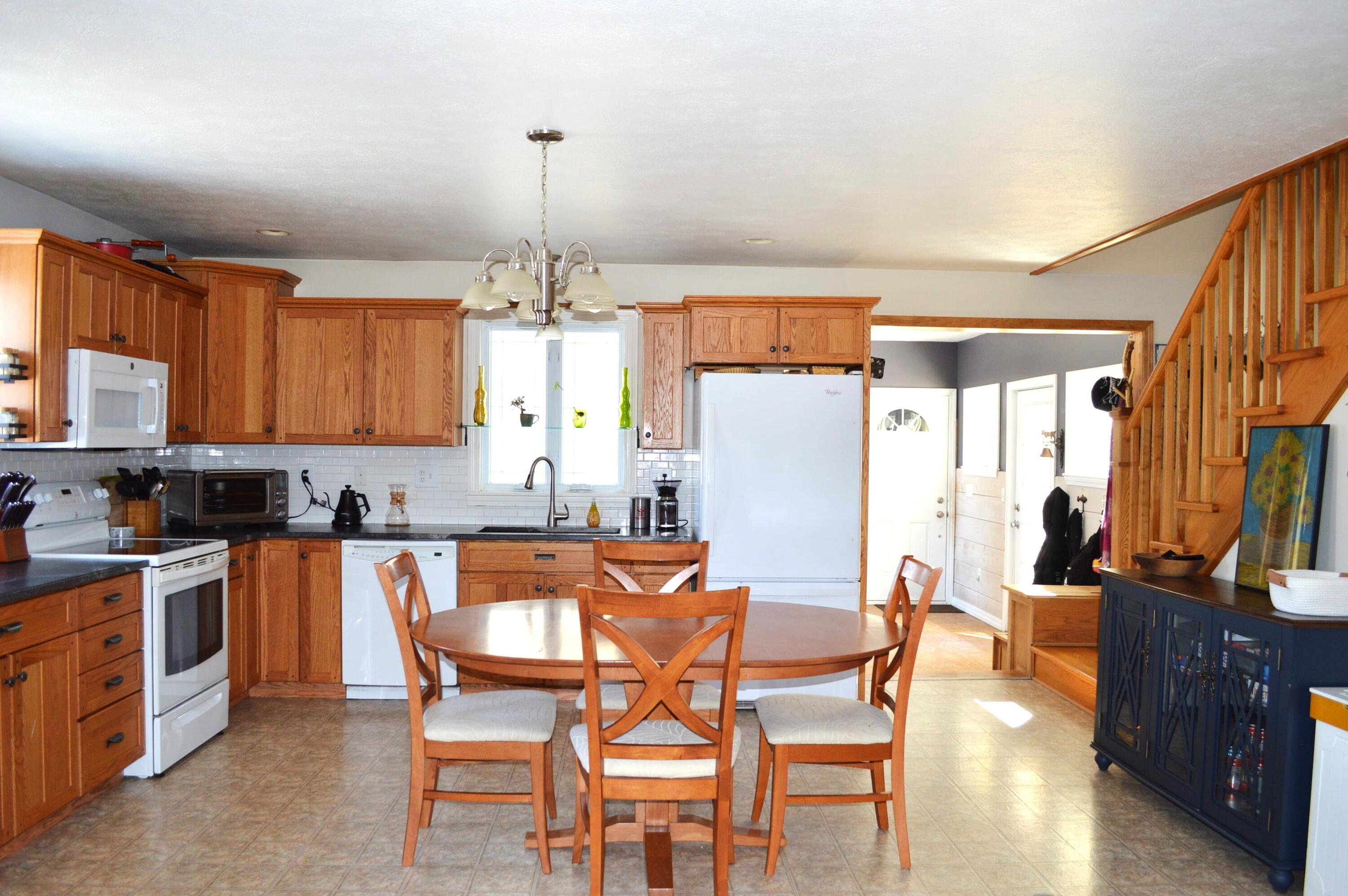 305 Market Street Fort Kent, ME 04743 - Photo 19 of 58 Kitchen to entry and upstiars stairway