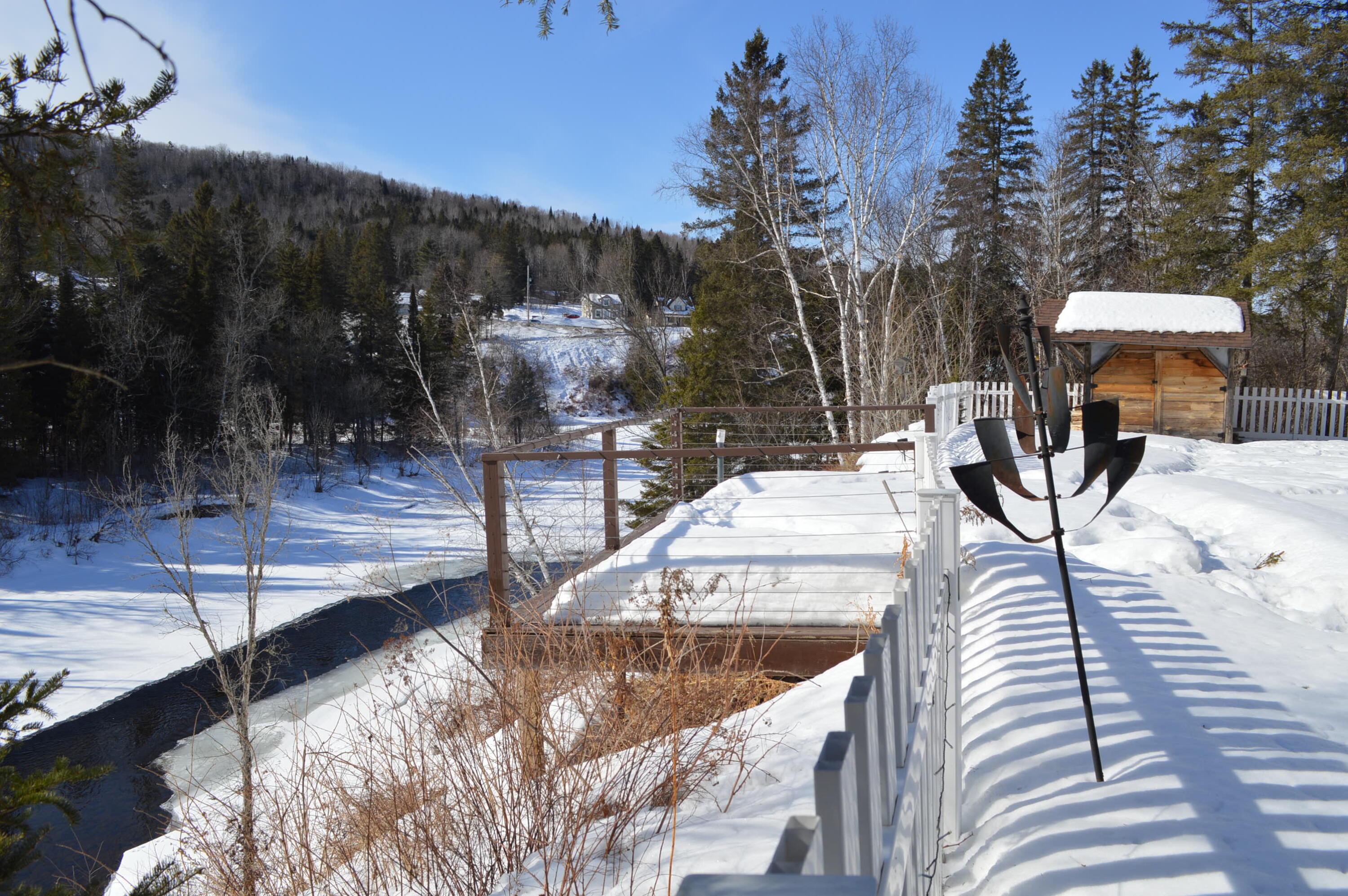 305 Market Street Fort Kent, ME 04743 - Photo 60 of 63 Overhanging deck with views of Fish Rive