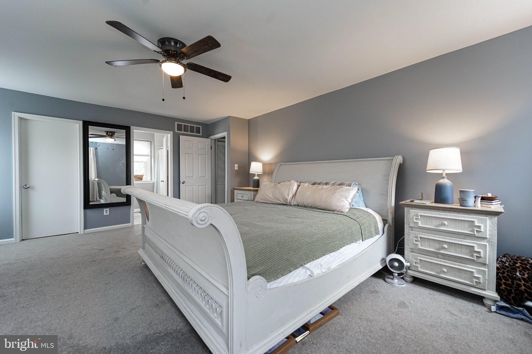 211 Queen Anne Road Stevensville, MD 21666 - Photo 29 of 33 Serene bedroom with modern elegance.