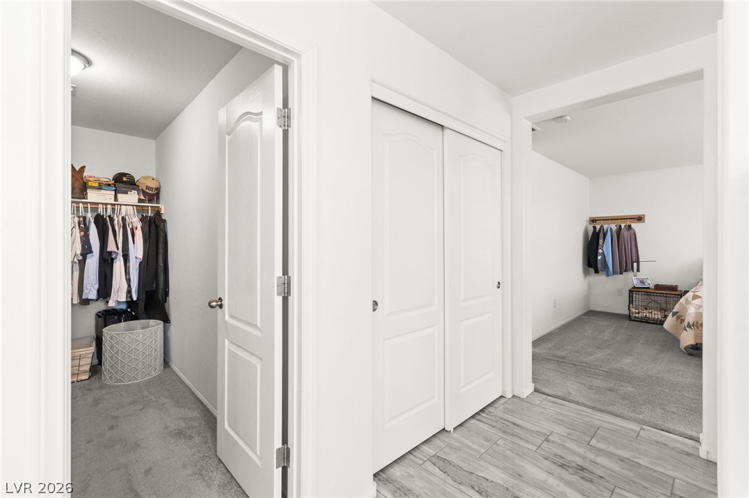 6435 Point Isabel Way Las Vegas, NV 89122 - Photo 30 of 57 Walk-in closet and adjacent secondary closet offer ample storage solutions for personal belongings.