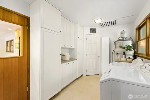 a bathroom with a sink and mirror with toilet