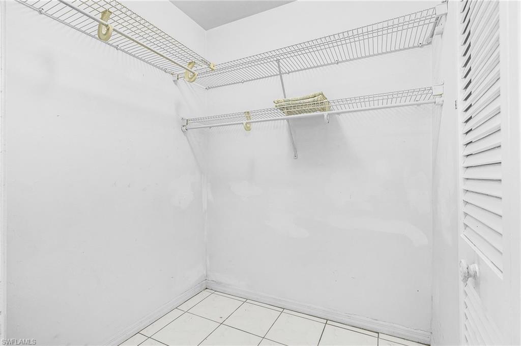 403 Southwest 34th Street Cape Coral, FL 33914 - Photo 28 of 32 Walk in closet featuring light tile patterned flooring