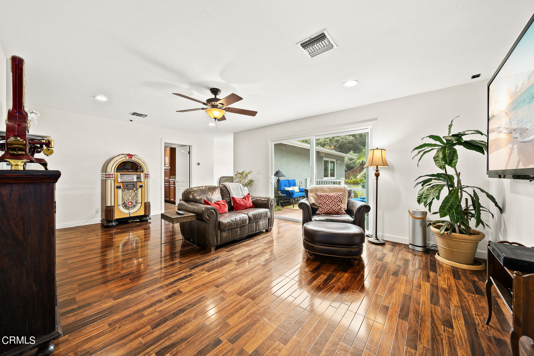9765 Tujunga Canyon Boulevard Tujunga, CA 91042 - Photo 12 of 51 a living room with furniture and a wooden floor