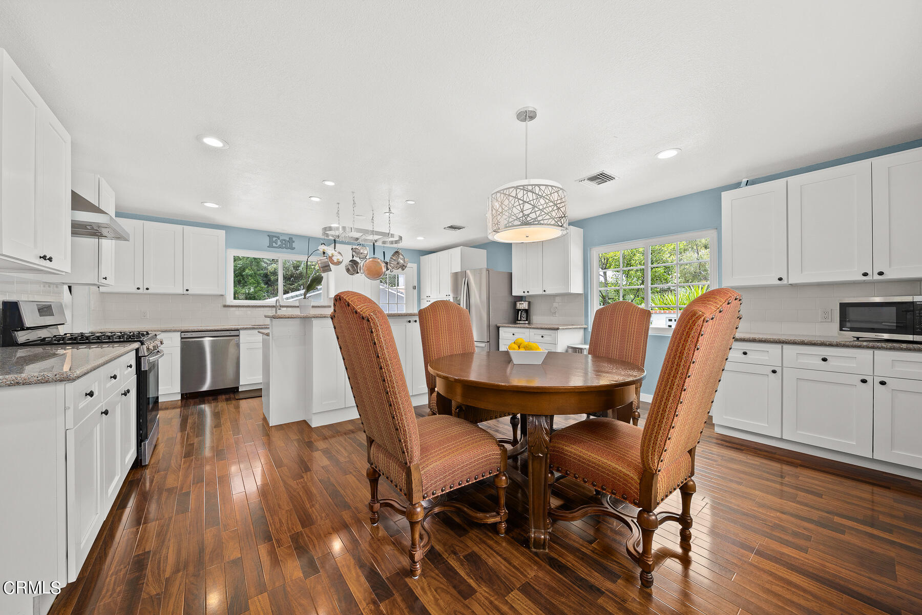 9765 Tujunga Canyon Boulevard Tujunga, CA 91042 - Photo 13 of 51 a view of a dining room with furniture and wooden floor
