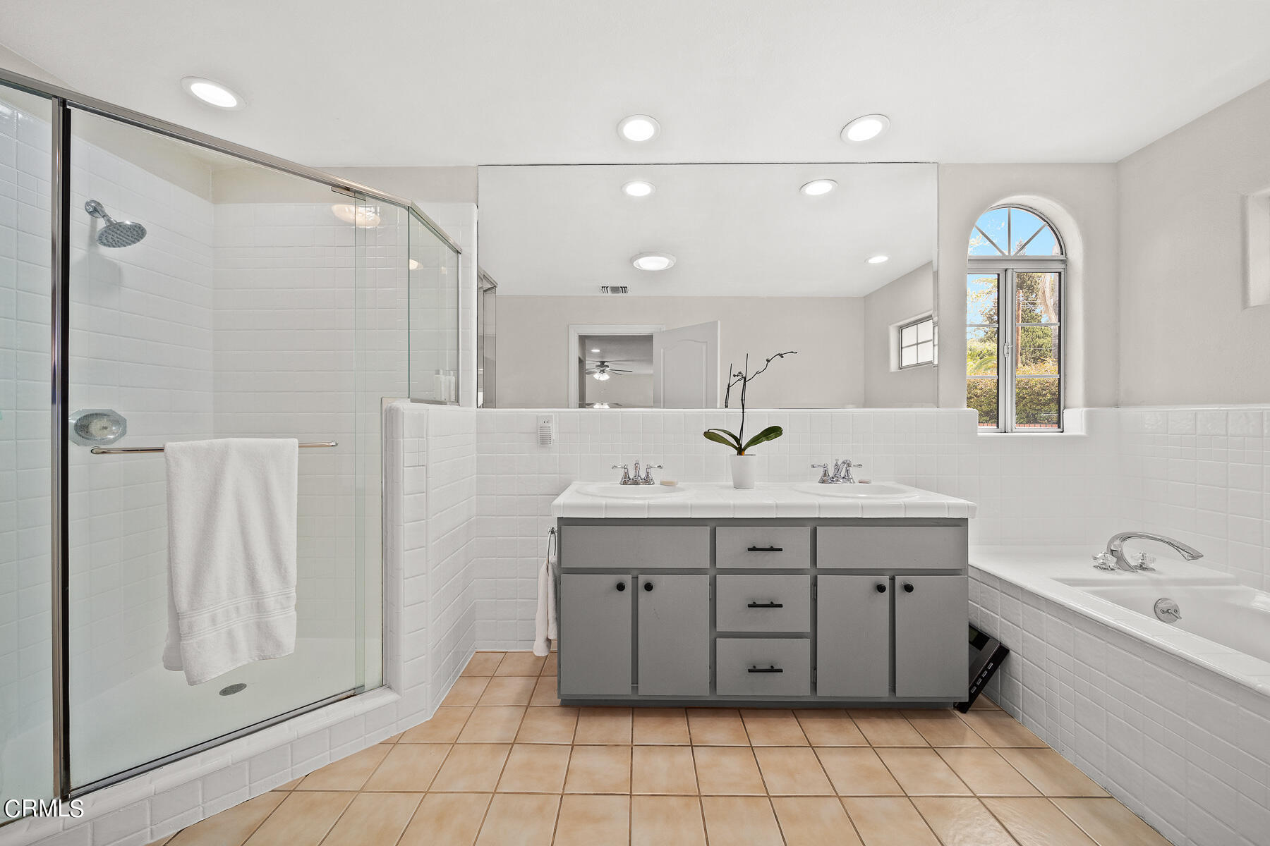 9765 Tujunga Canyon Boulevard Tujunga, CA 91042 - Photo 22 of 51 a spacious bathroom with a double vanity sink a mirror and a bathtub