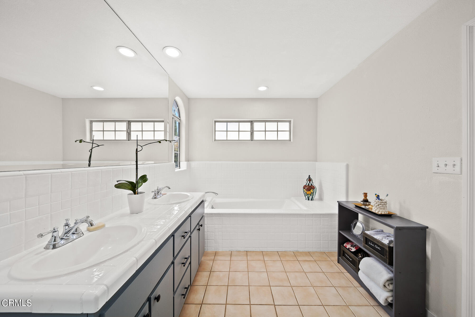 9765 Tujunga Canyon Boulevard Tujunga, CA 91042 - Photo 23 of 51 a bathroom with a sink a vanity and a bathtub