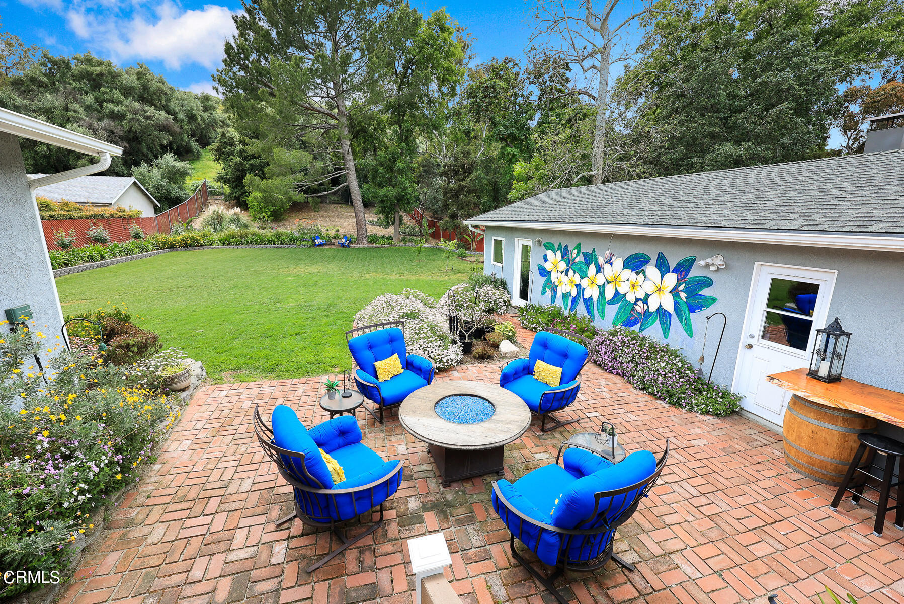 9765 Tujunga Canyon Boulevard Tujunga, CA 91042 - Photo 25 of 51 a view of a chairs and table in patio with a garden