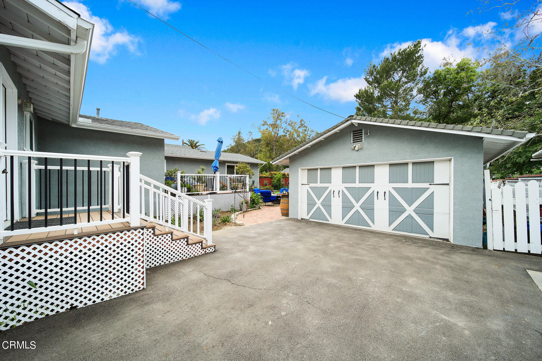 9765 Tujunga Canyon Boulevard Tujunga, CA 91042 - Photo 38 of 51 a view of a house with wooden deck and a porch