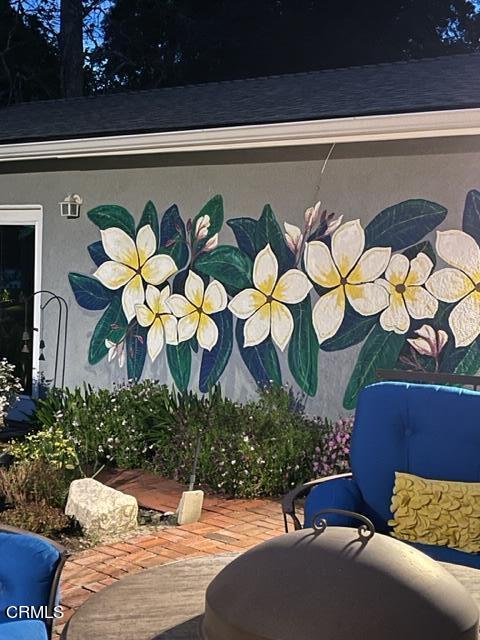 9765 Tujunga Canyon Boulevard Tujunga, CA 91042 - Photo 51 of 51 a vase of flowers sitting on a table with a potted plant