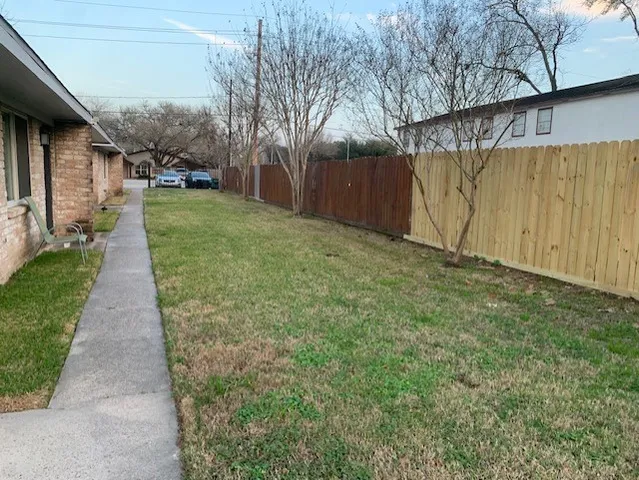 a backyard of a house with lots of green space