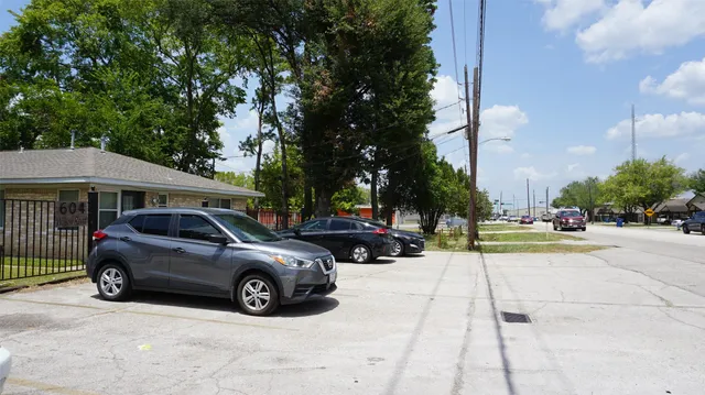 a view of a cars parked in front of a building