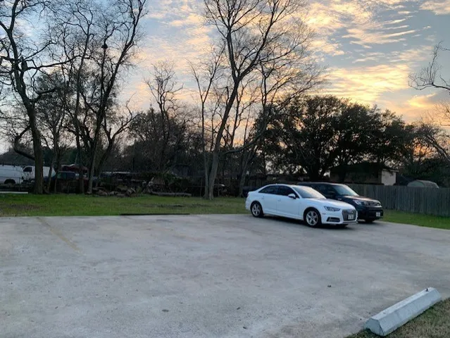a view of street with parked cars